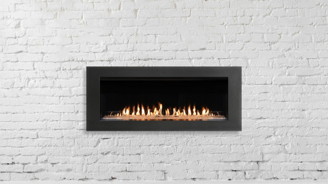 Fireplace on white brick wall