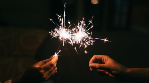 Hands holding a sparkler