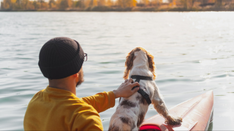 Man in a canoe with his dog