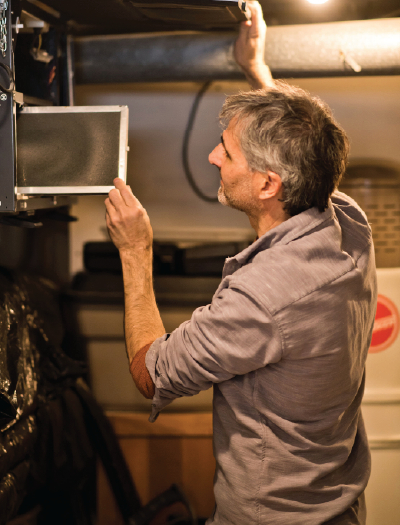 prairieHOUSE performance professional checks HRV in residential home basement.