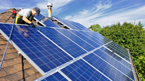 Man installing solar panels