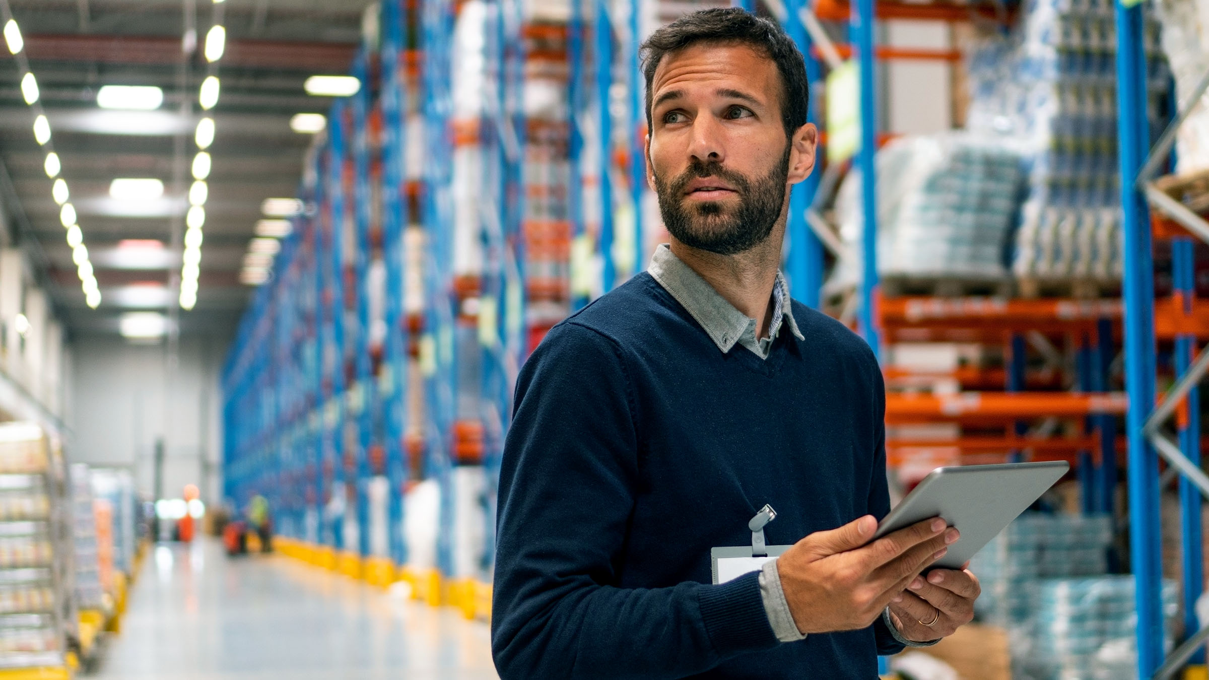 Person in warehouse with tablet